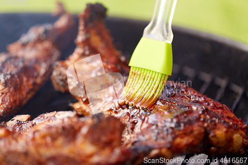 Image of close up of barbecue meat roasting on grill
