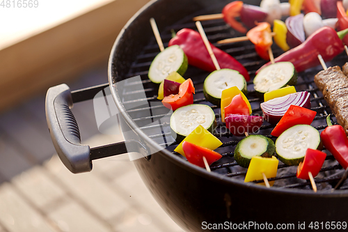 Image of close up of vegetables roasting on brazier grill