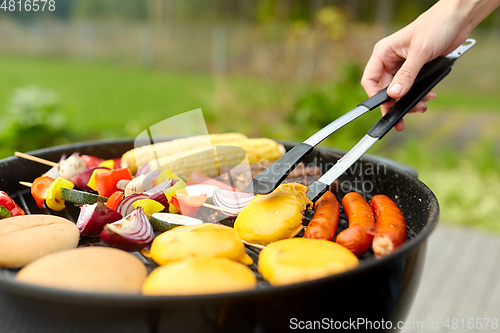 Image of barbecue kebab meat and vegetables on grill