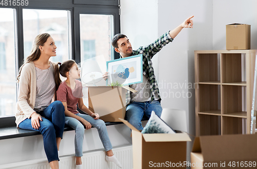 Image of happy family with child moving to new home