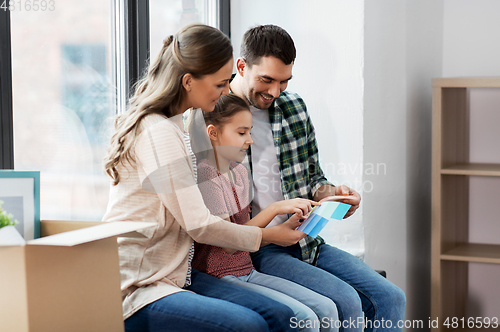 Image of happy family with color palette moving to new home