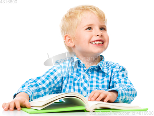 Image of Little child play with book