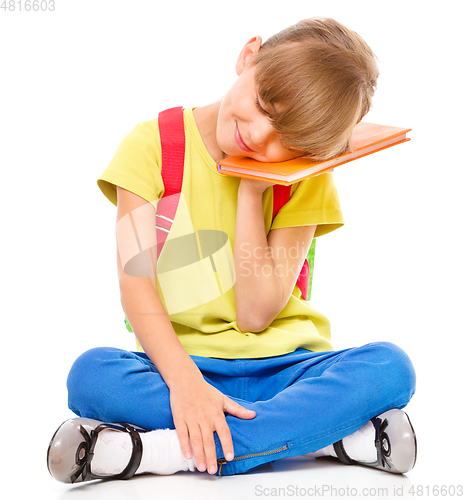 Image of Portrait of a cute little schoolgirl with backpack