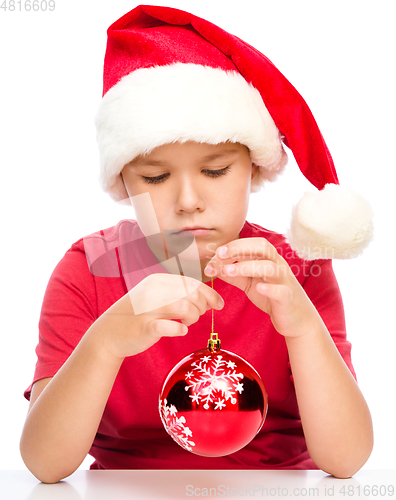 Image of Young unhappy girl in christmas cloth