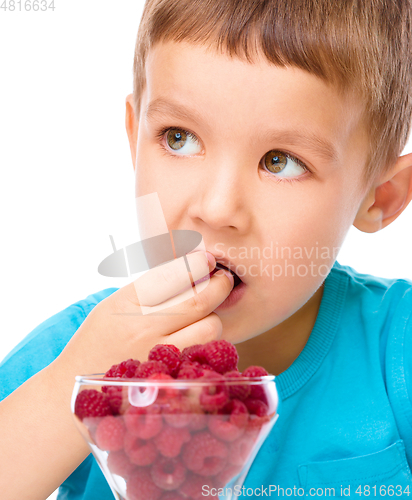 Image of Little boy with raspberries