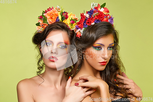 Image of beautiful girls with flower accessories