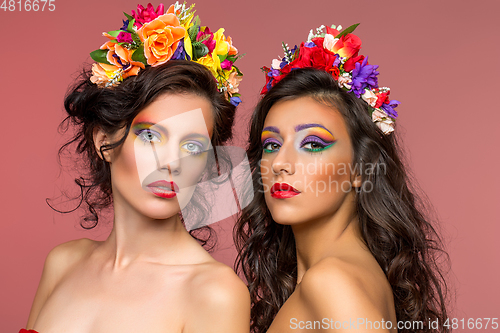 Image of beautiful girls with flower accessories