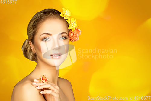Image of beautiful girl with flowers on head