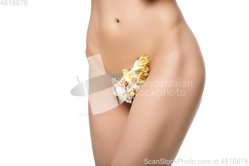 Image of beautiful woman naked body with flowers between legs 