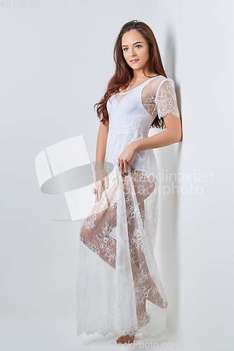 Image of beautiful girl in white lace dress