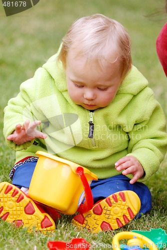 Image of A girl with a little bucket