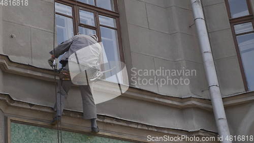 Image of MOSCOW - AUGUST 26: Climber spends repair work on a multi-storey building height on August 26, 2017 in Moscow, Russia