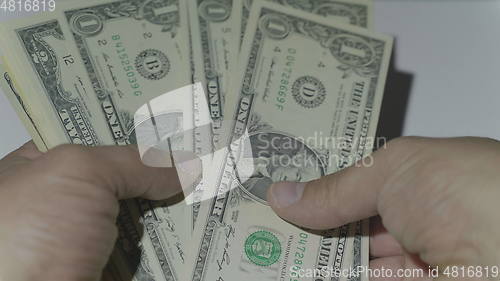Image of Man counting money of one thousand US dollars. UltraHD stock footage