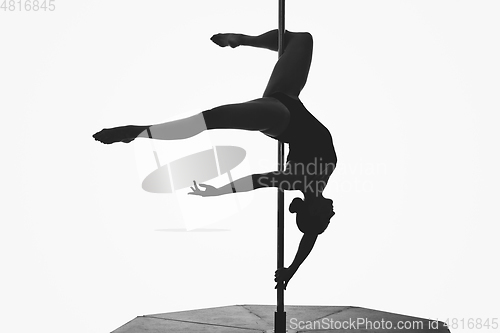 Image of beautiful pole dancer girl silhouette