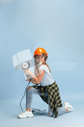 Image of Girl dreaming about future profession of engineer