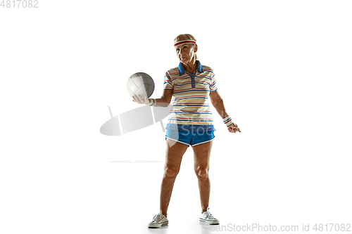 Image of Senior woman playing volleyball in sportwear on white background