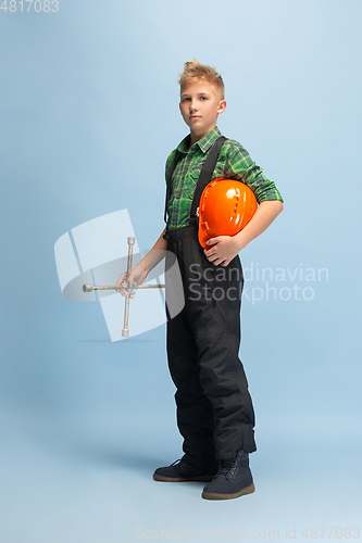 Image of Boy dreaming about future profession of engineer