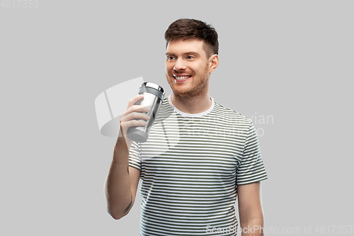 Image of man with thermo cup or tumbler for hot drinks