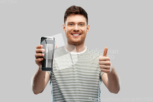 Image of man with thermo cup or tumbler showing thumbs up