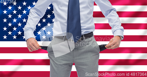 Image of close up of businessman showing empty pockets