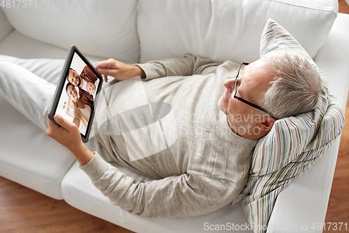 Image of senoir man having video call with family