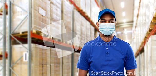 Image of indian delivery man in medical mask at warehouse