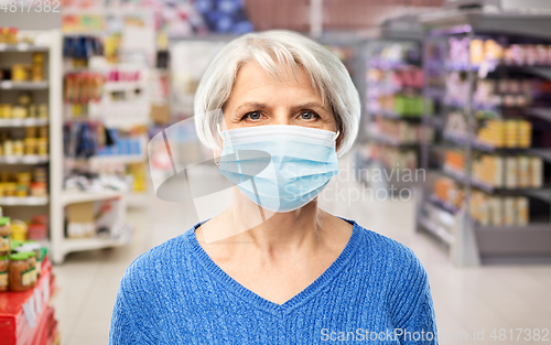 Image of senior woman in medical mask at supermarket