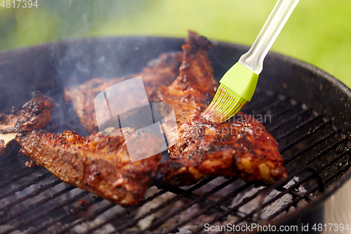 Image of close up of barbecue meat roasting on grill