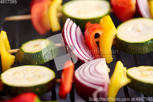 Image of close up of vegetables roasting on brazier grill