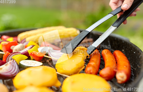 Image of barbecue kebab meat and vegetables on grill