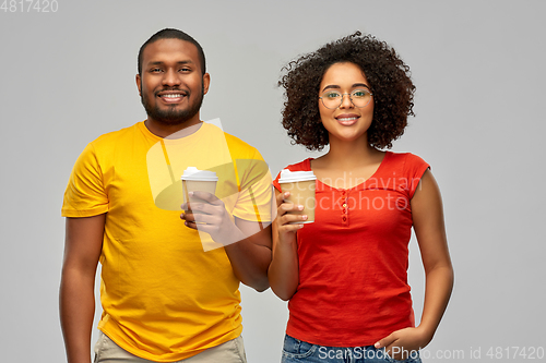 Image of happy african american couple with coffee cups