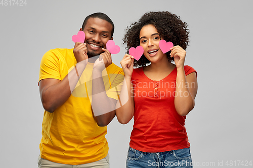 Image of happy african american couple with hearts