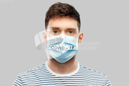 Image of young man in face protective medical mask