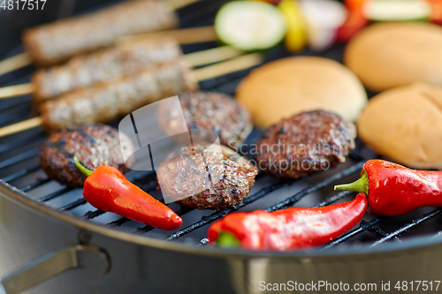 Image of barbecue kebab meat and vegetables on grill