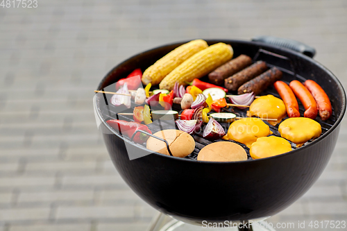 Image of barbecue kebab meat and vegetables on grill