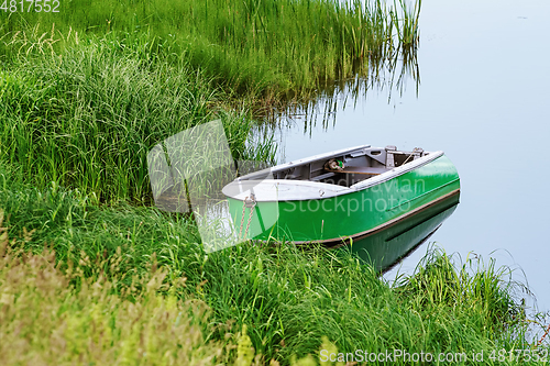 Image of Metal rowboat on the lake 