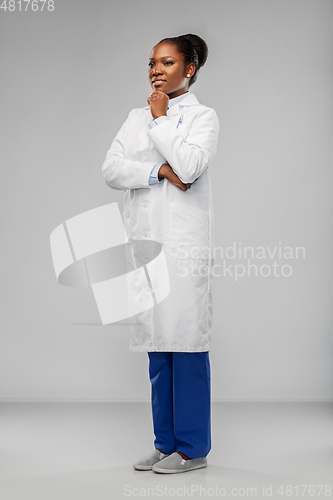 Image of happy african american female doctor or scientist