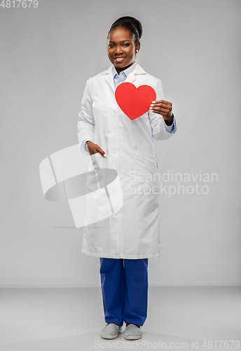 Image of african american female doctor with red heart