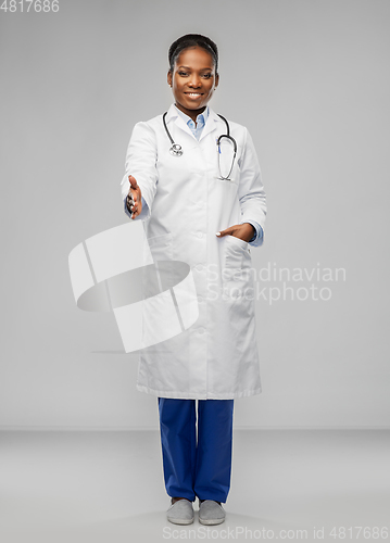 Image of african american female doctor making handshake