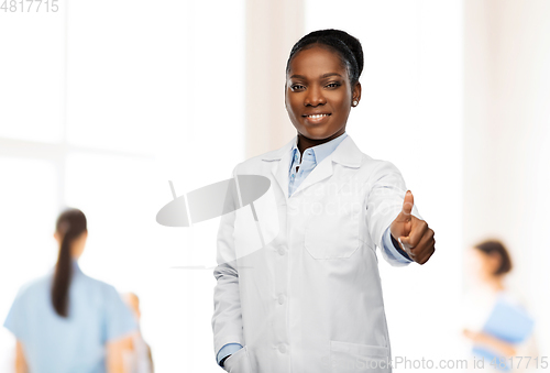 Image of african american female doctor showing thumbs up