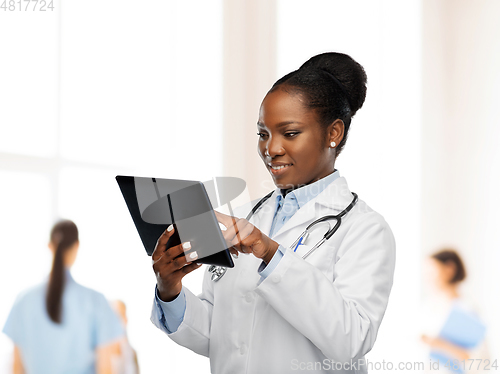 Image of african american female doctor with tablet pc
