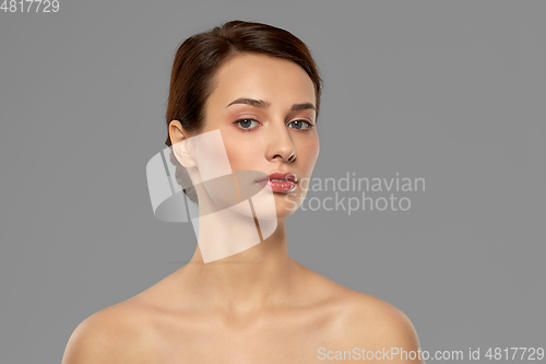 Image of beautiful young woman with bare shoulder