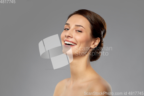 Image of beautiful young woman with bare shoulder