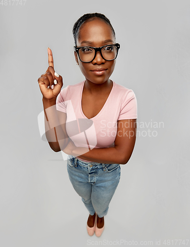 Image of african american woman in glasses with finger up