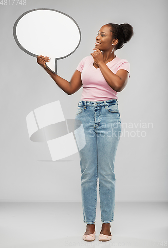 Image of happy african american woman holding speech bubble