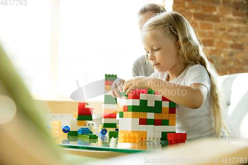 Image of Teacher and little girl, or mom and daughter. Homeschooling concept