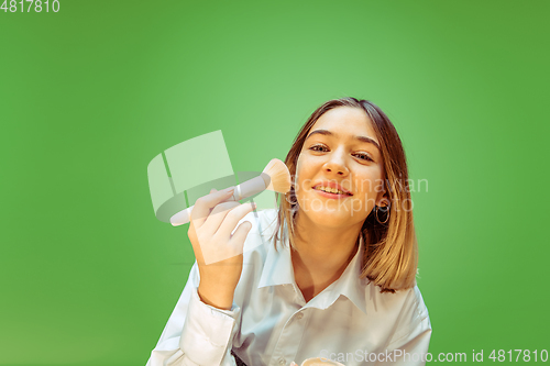 Image of Teen girl dreaming about future profession of makeup artist