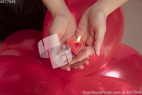 Image of Valentine\'s day celebration, happy caucasian couple isolated on coral background