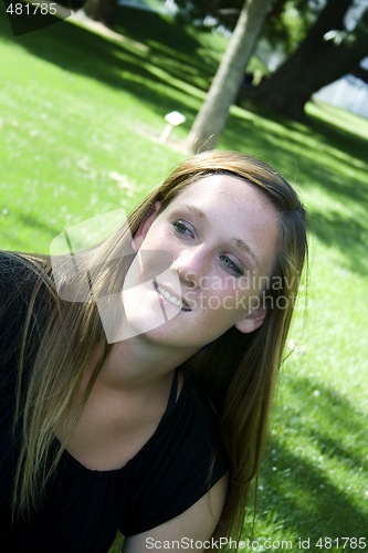 Image of Beautiful Girl in the Park in a Black Dress