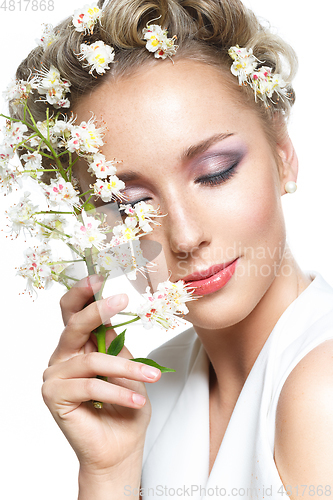 Image of beautiful girl with flowers in hair